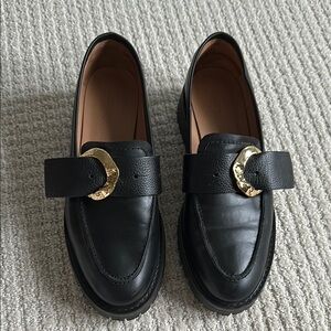 Flattered Stella Black Loafers with Gold Buckle